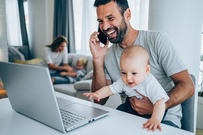 Review your private health insurance is important. Photo of man using a computer to review his private health cover